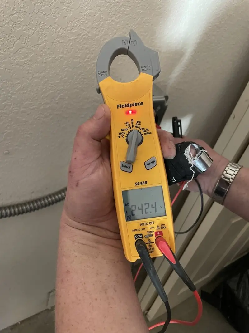 Voltage testing with clamp meter during Recessed Lighting Installation in Colonial Heights